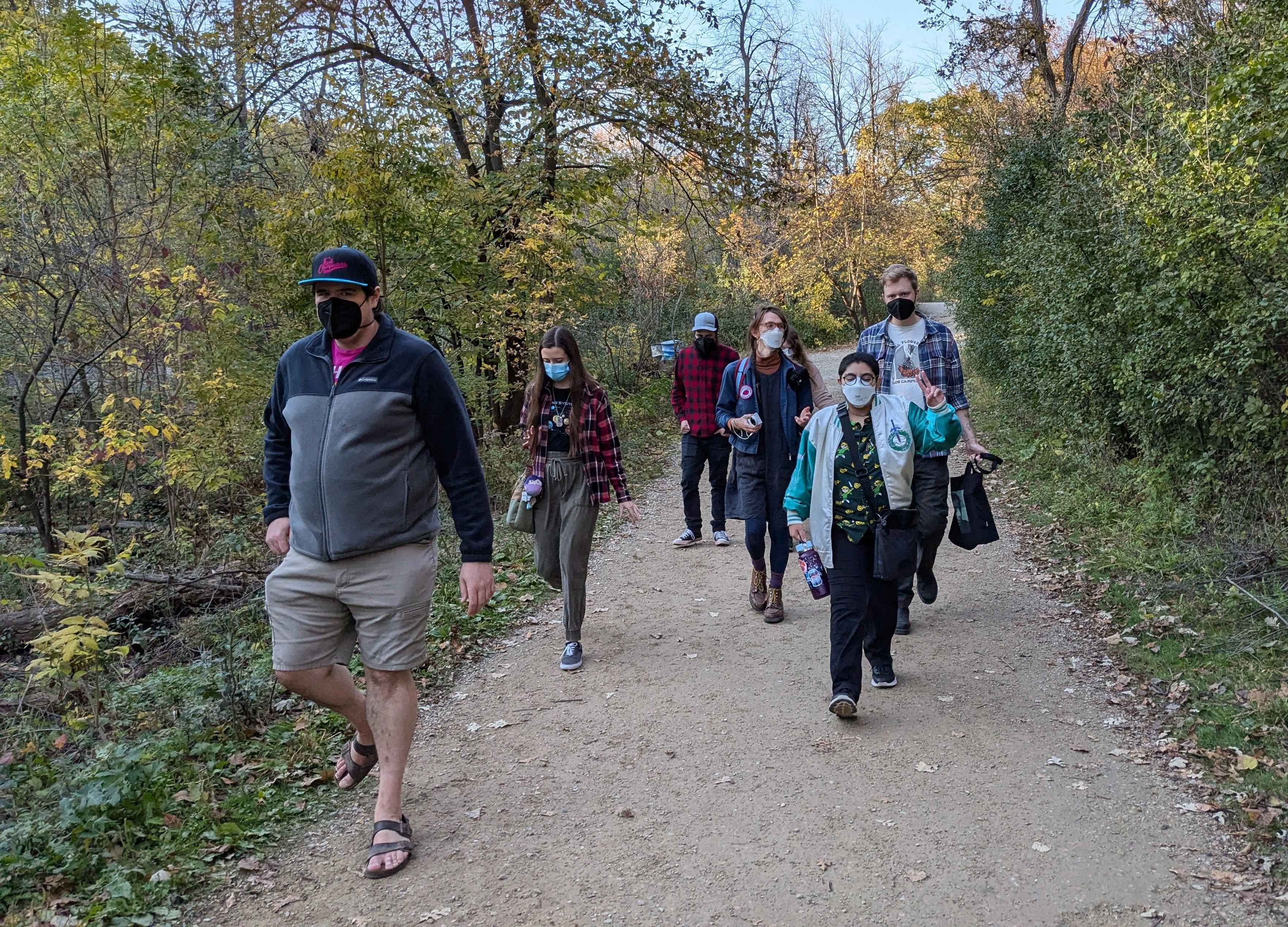 We’re all walking down the trail to the beach.