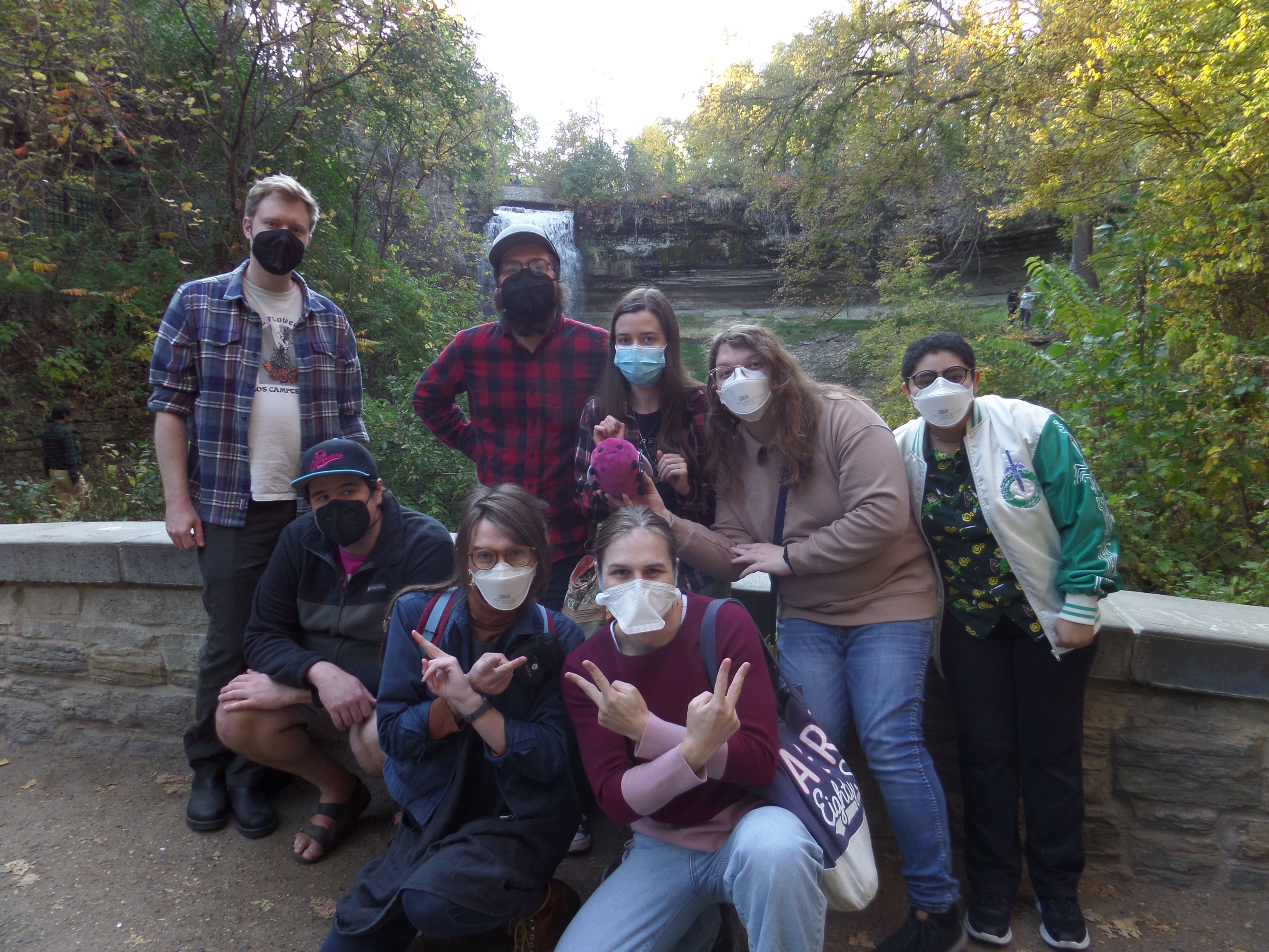 The Cohost Wake group doing a group shot in front of Minnehaha falls.